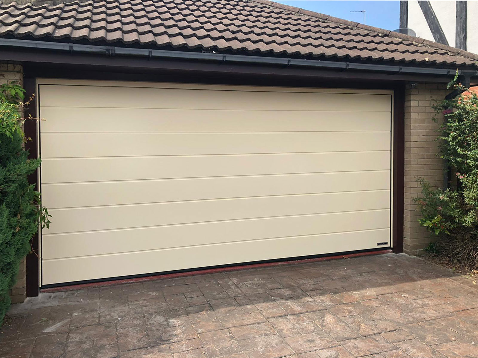 Cream Centre Ribbed Sectional Garage Door, South Manchester & Cheshire