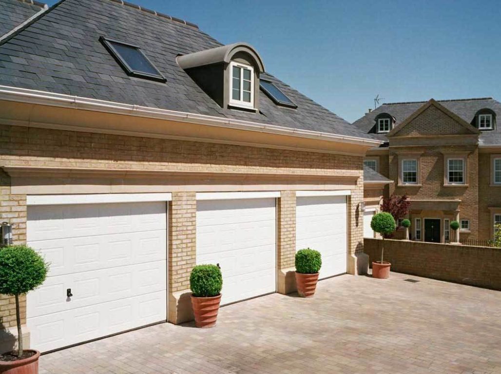 A Trio Of Oxley Georgian Insulated Sectional Garage Doors In White