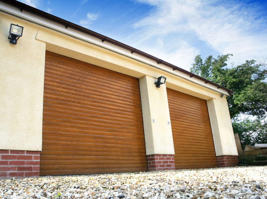 Oxley insulated twin roller garage doors finished in Golden Oak