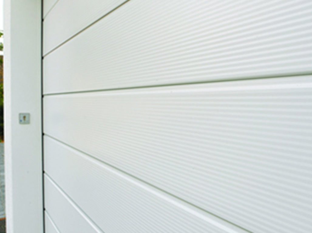 Oxley Standard Ribbed Sectional Garage Door Finished In White With The Micro-Profiled Texture Option