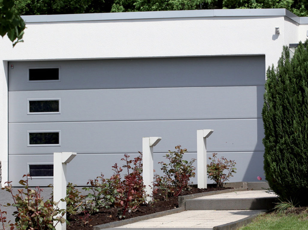 Oxley Solid Design Insulated Sectional Garage Door In Light Grey With Micro-Profile Texture